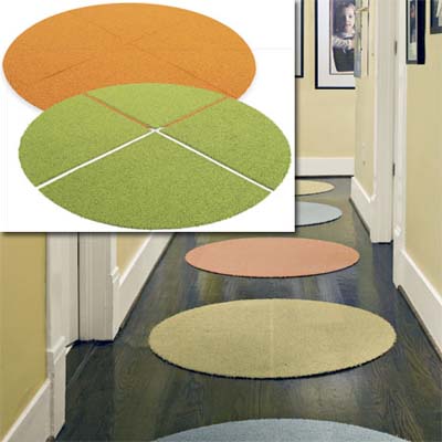 examples of carpet-tile circle rugs inset in the image of the decorated hallway of this remodeled bungalow kitchen
