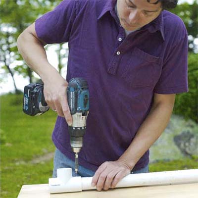 mark powers drilling holes in pvc pipes for weave bars