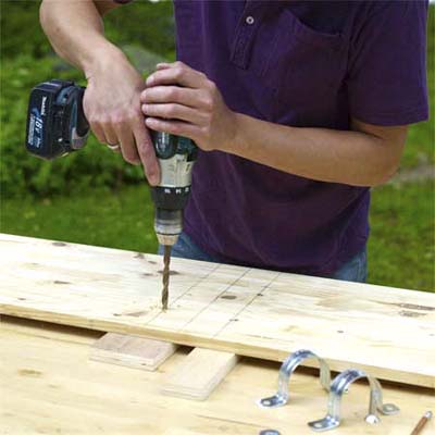 drilling the holes in the teeter-totter