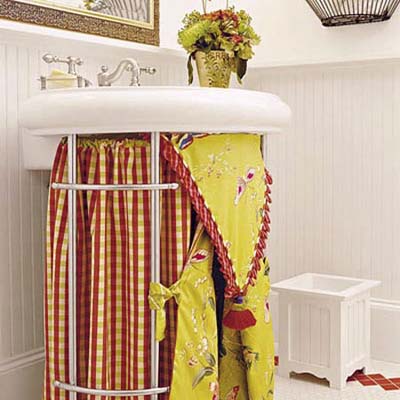 brightly colored skirt around a bathroom pedestal sink