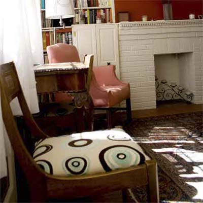 re-upholstering a chair can help tie colors and patterns of a room together