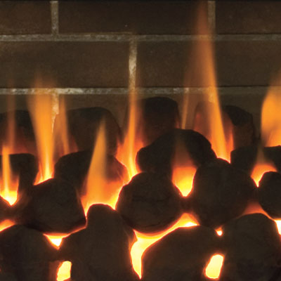 a gas fireplace bed made of ceramic made to look like coal