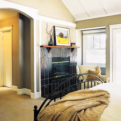 a gas fireplace in the bedroom