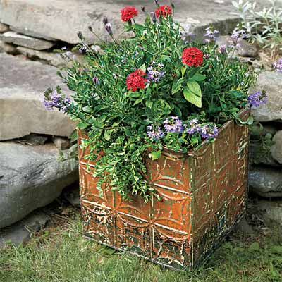 example of tin ceiling tiles used to decorate an outdoor planter