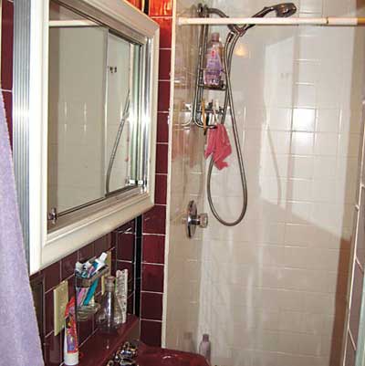 small, dimly lit outdated bathroom