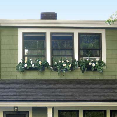 an closeup of windows and windowboxes that were given a makeover
