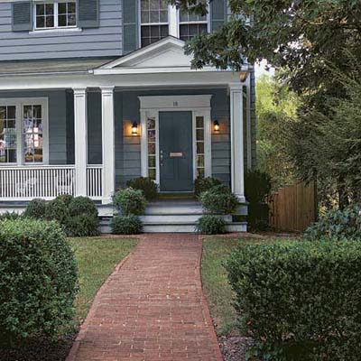 a closeup of a house with a front yard makeover