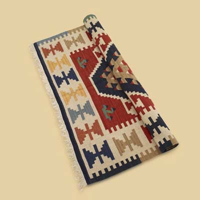 a handwoven rug made by Overstock