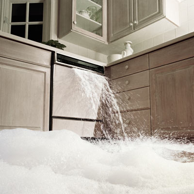 dishwasher overflowing water onto kitchen floor