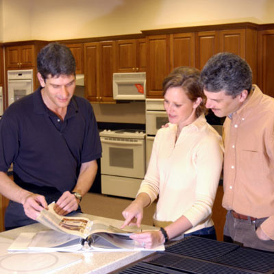 couple looking at catalog with contractor