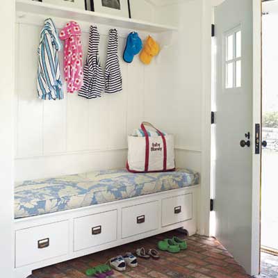 mudroom with storage bench and coat hooks