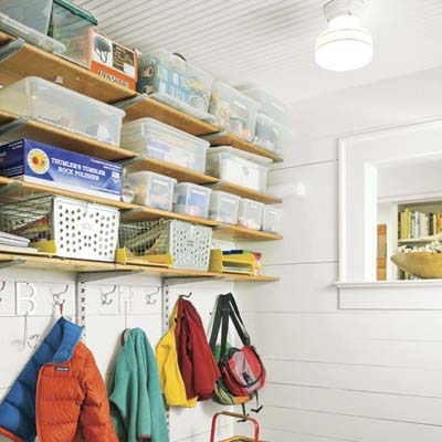 mudroom with shelving, coat hooks and bench