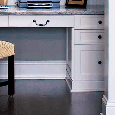 home office nook with beadboard and cabinets