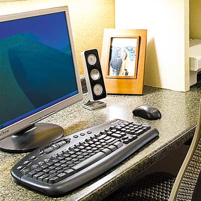 desktop with wireless keyboard and mouse in home office