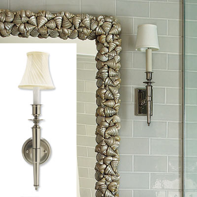 wall sconces in white tiled bathroom