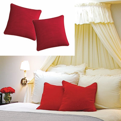 feminine bedroom with red throw pillows