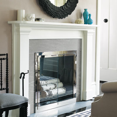fireplace with white mantle and gray toned walls