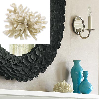 white coral centerpiece on fireplace mantel in serene home