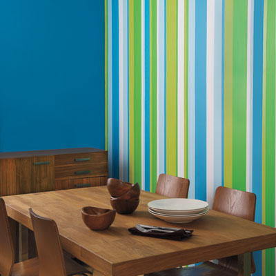 dining room with colorful painted striped accent wall
