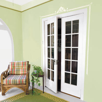 interior door with painted stencil border on its eave