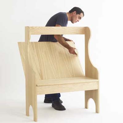 man building built-in seating for a breakfast nook
