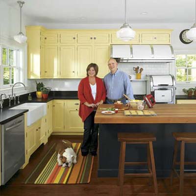 couple and dog in their newly remodeled vintage look italianate kitchen