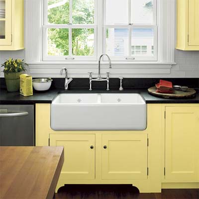 faucet and chunky sink surrounded by custom cabinets in this remodeled italianate kitchen