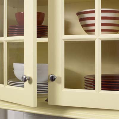 custom glass window panes used for the glass cabinets in this remodeled italianate kitchen 