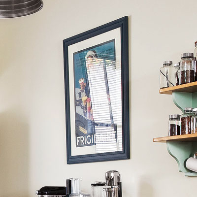framed vintage poster in retro modern kitchen
