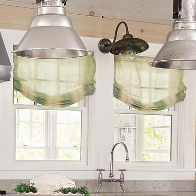 farmhouse kitchen with green light diffusing shades