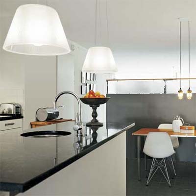 two styles of pendant lights hanging in an open design modern kitchen