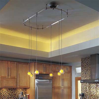 multiple pendant lights on an oval track fixture