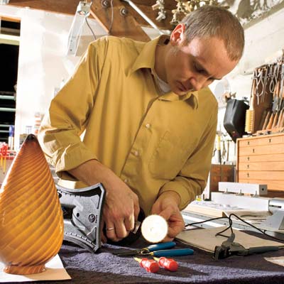 eric kaster making lighting fixture in workshop