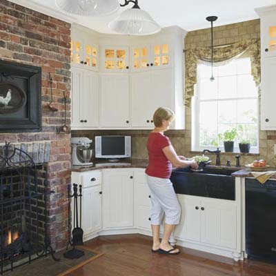 newly finished kitchen with shaker-style cabinets and gas fireplace