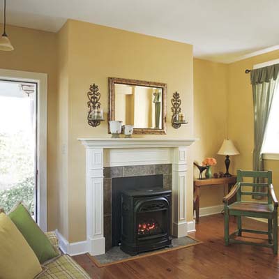 newly finished living room with pine floors and gas stove