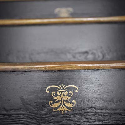 black staircase with gold stencil design