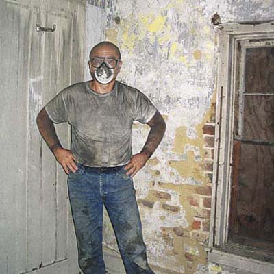 Homeowner Walt Purcell dirty from renovating house