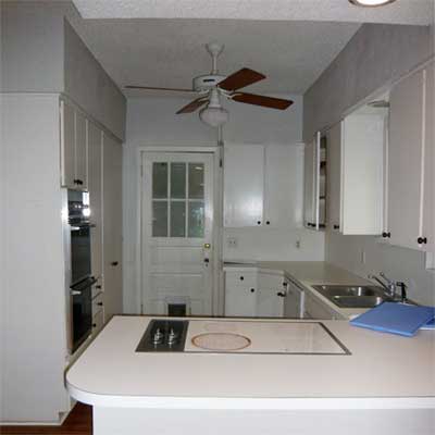 unfinished kitchen with ceiling fan