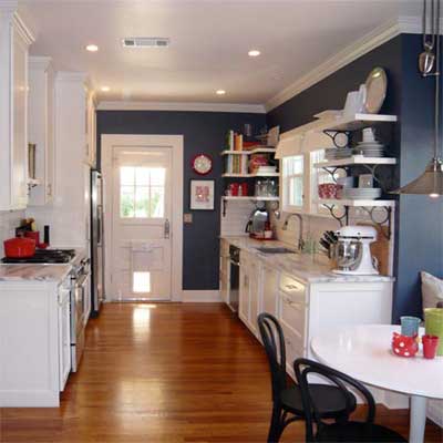 finished kitchen with wood floor and navy walls