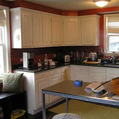 unfinished kitchen with red walls