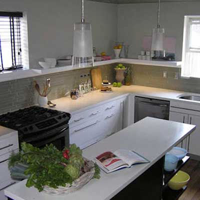 remodeled kitchen with white cabinetry and wall shelves