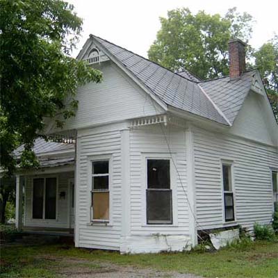 dilapidated white house