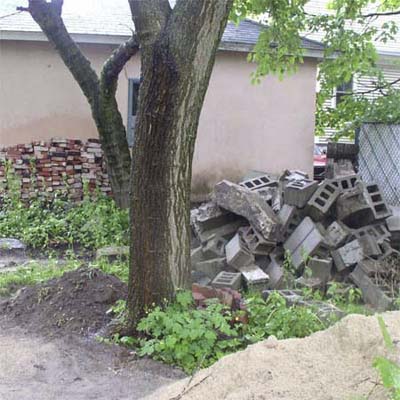 backyard with pile of cinder blocks
