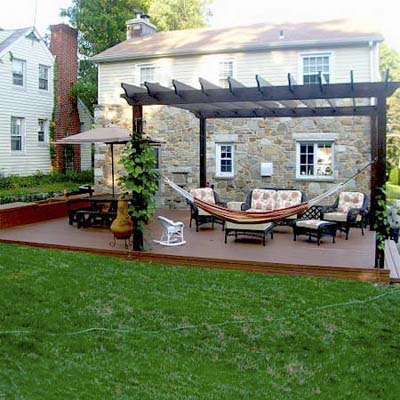 manicured back patio with brick path