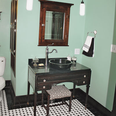 updated bathroom with vintage vanity and medicine cabinet
