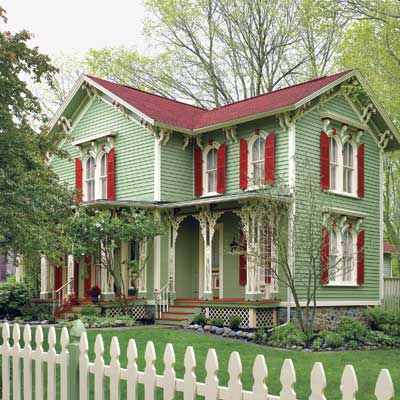 updated victorian home with green and red paint