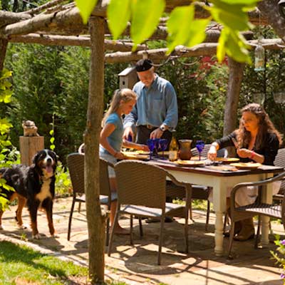 family sitting down to a meal outdoors