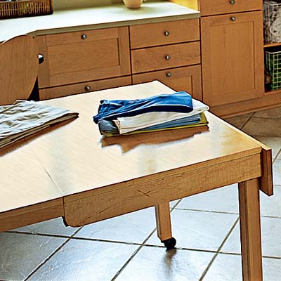 roll away craft table for folding laundry in work station laundry room
