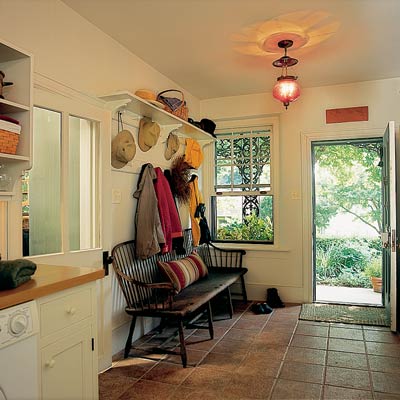 terra cotta tile floor in laundry room mud room
