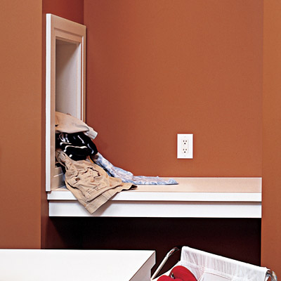 laundry chute in family room laundry room
